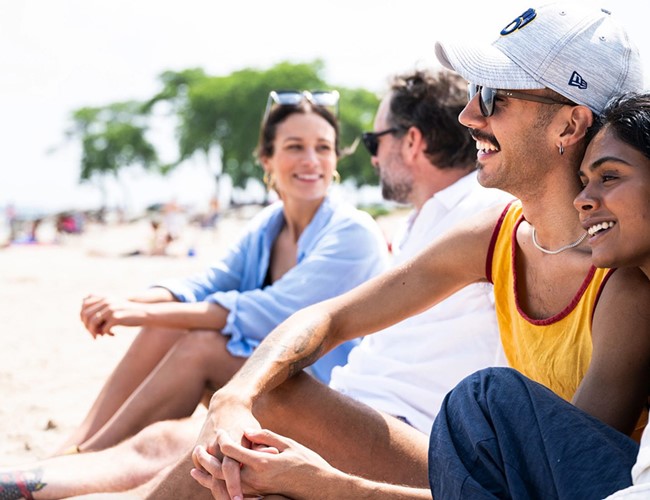 Friends sitting at Bradford Beach