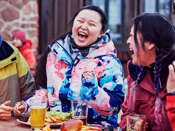 Plan Your Vacation - 071 Friends Enjoying Meal at Ski Hill